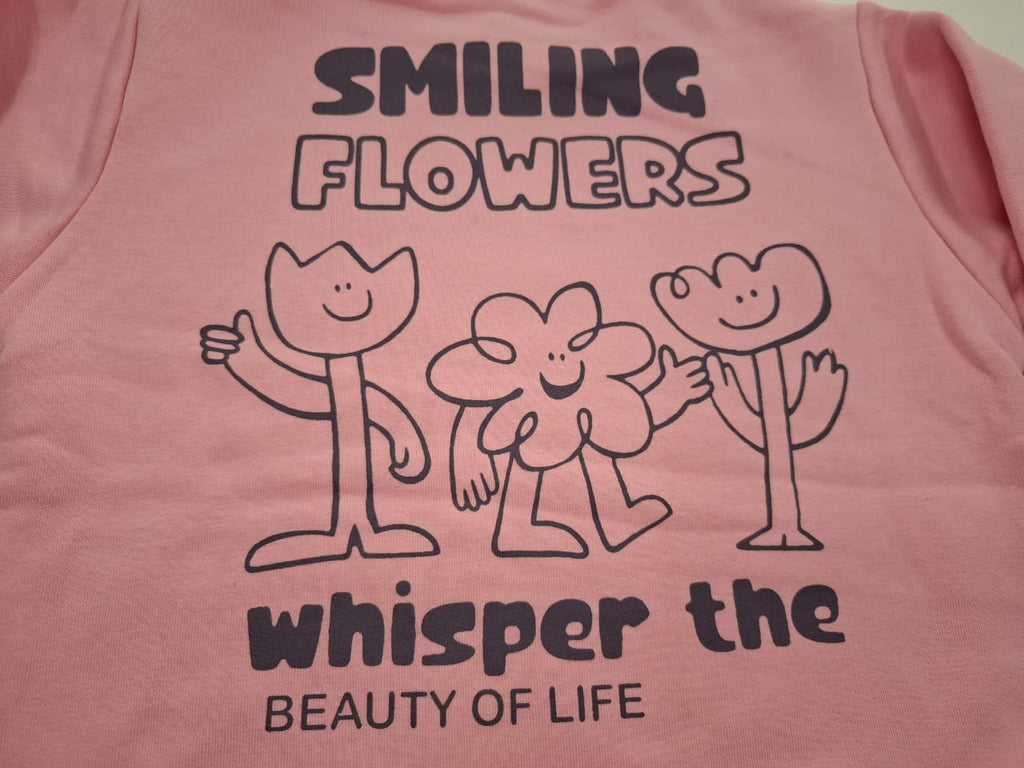 Whisper the Beauty: Pink Sweatshirt with Smiling Flowers Graphic