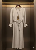 Pleated Perfection: The Long Sleeve Midi Dress in Stone